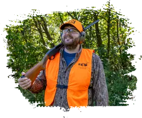 Parent and child outdoors in hunting gear