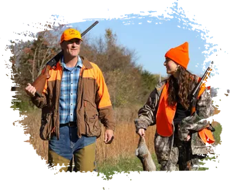 Adult hunters walking through the woods